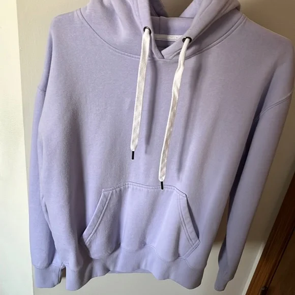 Light purple hoodie with white strings. Size small but fits a bit bigger